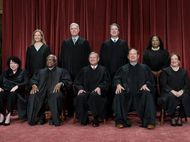 Members of the Supreme Court sit for a new group portrait following the addition of Associate Justice Ketanji Brown Jackson, at the Supreme Court building in Washington, on Oct. 7, 2022. Bottom row, from left, Associate Justice Sonia Sotomayor, Associate Justice Clarence Thomas, Chief Justice of the United States John Roberts, Associate Justice Samuel Alito, and Associate Justice Elena Kagan. Top row, from left, Associate Justice Amy Coney Barrett, Associate Justice Neil Gorsuch, Associate Justice Brett Kavanaugh, and Associate Justice Ketanji Brown Jackson.