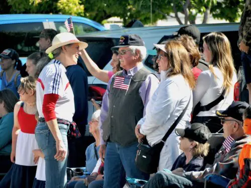 Monica Tranel, left, speaks to community members at the Memorial Day parade in Corvallis, Montana on May 27, 2024. (Credit: Richard Manning)