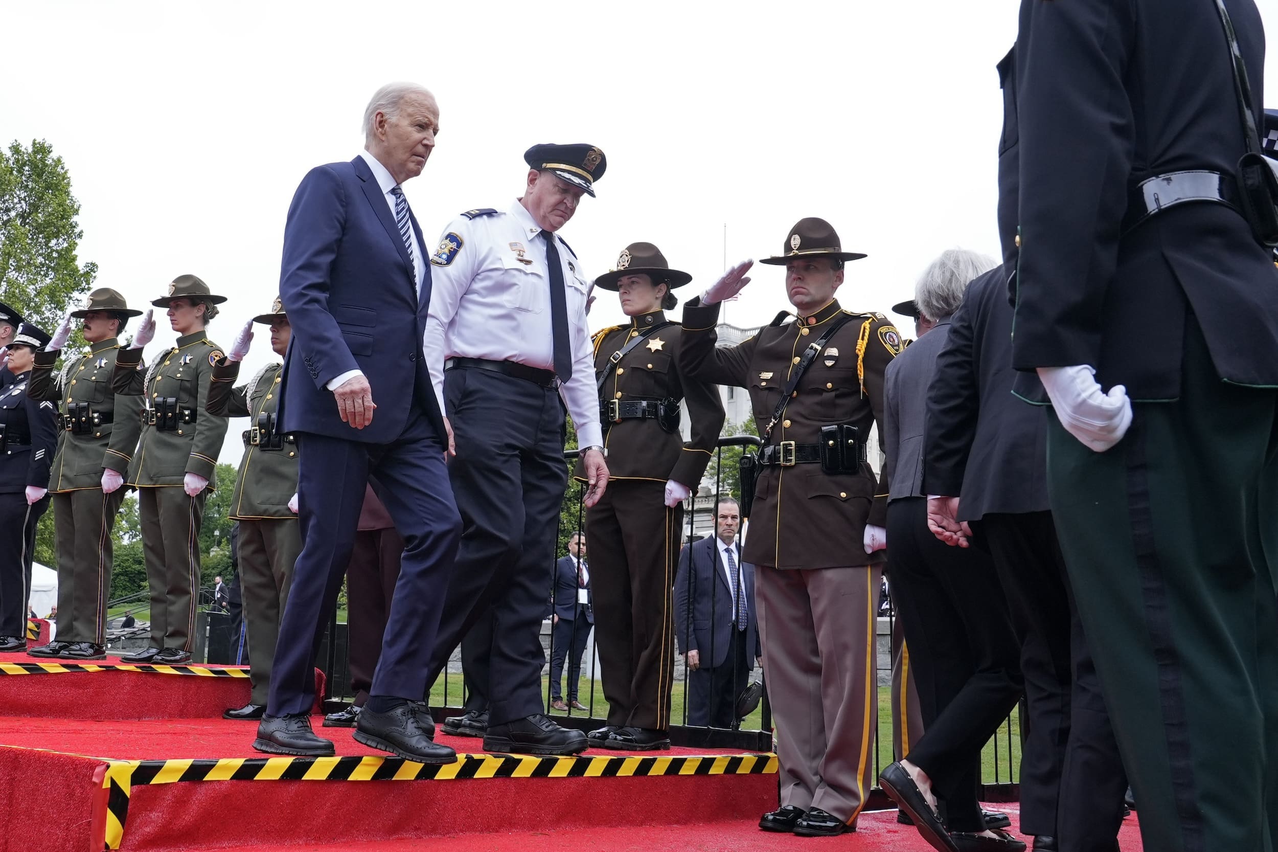 President Joe Biden, left, walks off of the stage with National Fraternal Order of Police President Patrick Yoes, during a memorial service to honor law enforcement officers who've lost their lives in the past year, during National Police Week ceremonies at the Capitol in Washington, Wednesday, May 15, 2024. (AP Photo/Susan Walsh)