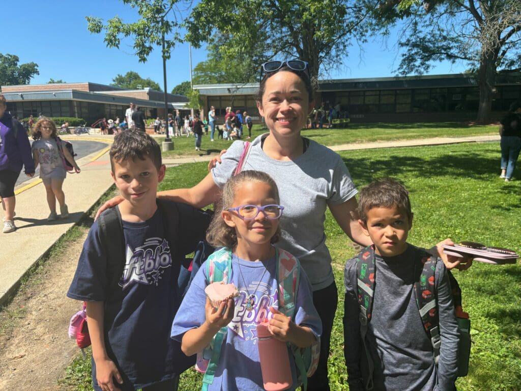 Kristen McGlaston with her three children, who are Ann Arbor Public School students.